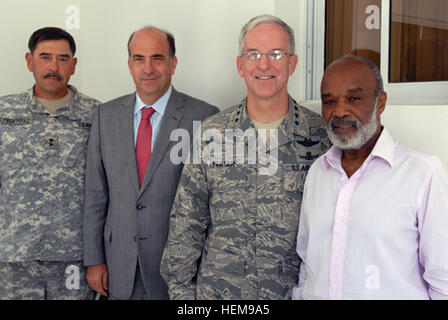 Maj. Gen. Simeon Trombitas, commanding general, JTF-Haiti, Ken Merten, U.S. ambassador to Haiti, Gen. Douglas M. Fraser, commanding general, U.S. Southern Command, and Rene Preval, president of Haiti, stop for a group shot after holding a meeting to discuss the ongoing relations between the U.S. and Haiti. Fraser visited the Port-au-Prince area May 3 to see first-hand the improvements made and the missions accomplished under Operation Unified Response. Gen. Fraser's visit to Haiti 275429 Stock Photo