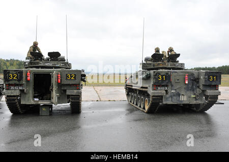 British Army soldiers assigned to Bravo Company, 3rd Mercian, line up their Warrior Infantry Fighting Vehicles for a weapons calibration  during Saber Junction 2012 at Grafenwoehr Training Area on Oct. 15. The U.S. Army in Europe's exercise Saber Junction trains U.S. personnel and more than 1800 multinational partners from 18 European nations, ensuring interoperability between forces and an agile, ready coalition force. (U.S. Army Europe photo by Visual Information Specialist Gertrud Zach/Released) Saber Junction 2012 121015-A-HE359-040 Stock Photo