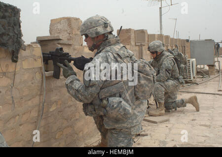 Soldiers from Bravo Company,  2nd Battalion, 23rd Infantry Regiment, 4th Brigade Combat Team, 1st Infantry Division and the 1st Cavalry Division provide security at Combat Outpost Amanche in the Rasheed area of Baghdad, Iraq, May 11. Combat Outpost Amanche 45246 Stock Photo