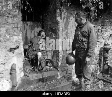 This dead German soldier was one of the 'last stand' defenders of German-held Cherbourg.  Capt. Earl Topley, who led one of the first outfits into the fallen city, blamed him for killing three of his boys.  France, June 27, 1944.  Zwick.  (Army) NARA FILE #:  111-SC-193970 WAR & CONFLICT BOOK #:  1050 Dead German soldier in Cherbourg Stock Photo