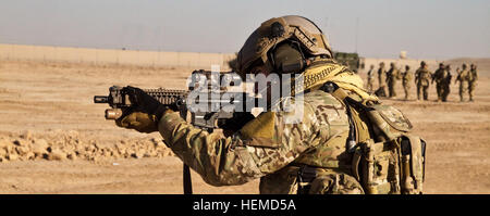 Coalition soldier participates in training at a firing range in Helmand Province, Afghanistan.Jan 3, 2013. (U.S. Army Photo by Spc. Matthew R. Hulett) Firing range training 121224-A-KM292-024 Stock Photo