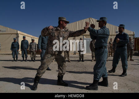 An Afghan Border Police student demonstrates hand-to-hand combatives during a class at the Lashkar Gah Training Center in Lashkar Gah, Helmand province, Afghanistan, Jan. 15, 2013. U.S. Army Brig. Gen. Sedric Wins and French Gendarmerie Brig. Gen. Christian DuPouy, the commander and deputy commander for police, NATO Training Mission-Afghanistan, toured the site to observe firsthand how training of all pillars of the ANP was progressing. (U.S. Army photo by Bill Putnam/Released) Lashkar Gah Training Center 130115-A-YI377-0336 Stock Photo