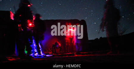 An Afghan and coalition security force arrested a Taliban facilitator in Kandahar Province, Jan 17, 2013. The detained Taliban facilitator was responsible for coordinating and executing Improvised explosive devices (IED) attacks against Afghan and coalition forces. He over saw the distribution of IED's and other forms of lethal aid to insurgents operating in Arghandab district. (U.S. Army photo by Philip L. Diab) Afghan, coalition security force arrest Taliban facilitator 130117-A-GQ805-060 Stock Photo