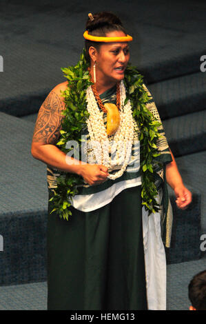 Kumu Hula Hinaleimoana Wong from the Kalu Halau Lokahi Public Charter School says the Hawaiian blessing during the Hawaiian Medal of Honor Ceremony at the State Building in Honolulu, March 27, 2013. As of Dec. 31, 2012, Hawaii has lost 327 Service members with Hawaiian ties who gave their lives in support of Operation Iraqi Freedom and Operation Enduring Freedom. (U.S. Army photo by Sgt. Daniel Schroeder/Released) Honoring the fallen 130327-A-UG106-038 Stock Photo