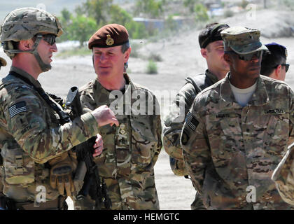 From left, U.S. Army 1st Lt. Colin Smith with the 744th Ordnance Company, 184th Ordnance Battalion, 52nd Ordnance Group, briefs British Army Gen. Sir Richard Shirreff, NATO's Deputy Supreme Allied Commander Europe, and U.S. Army Brig. Gen. Ronald Lewis, the 101st Airborne Division's deputy commanding general for support, as they observe counter-improvised explosive device awareness training at Forward Operating Base Gamberi in Laghman province, Afghanistan, April 16, 2013.  (U.S. Army photo by Staff Sgt. Richard Andrade/Released) Deputy Supreme Allied Commander Europe visits FOB Gamberi 130421 Stock Photo