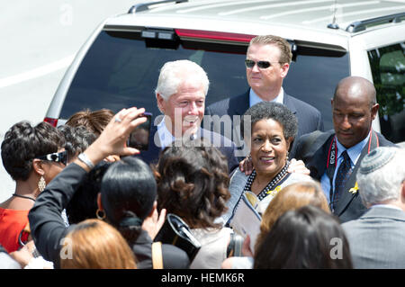 Former President Bill Clinton and Myrlie Evers-Williams, Chairman Emeritus  of the NAACP National Board of Directors speak with spectators following a memorial ceremony commemorating the 50th anniversary of the assassination of Civil Rights Activist Medgar Evers held at the Old Memorial Amphitheater in Arlington National Cemetery, Arlington, Va., June 5, 2013.(U.S. Army photo by Spc. Joel LeMaistre/Released) Medgar Evers Memorial 130605-A-LR102-224 Stock Photo