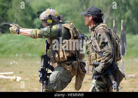 Special Operation Forces from nine different nations participate in the International Special Training Center's Advanced Close Quarter Battle course the 7th Army Joint Multinational Training Command's at Grafenwoehr Training Area, Germany, May 22, 2014. The International Special Training Centre in Pfullendorf, Germany provides centralized training for NATO Special Forces and similar units in Europe.  (U.S. Army Photo by Visual Information Specialist Gertrud Zach/Released) (This photo was manipulated with a blur filter on faces) ISTC ACQB course at JMTC, Germany 140522-A-HE359-162 Stock Photo