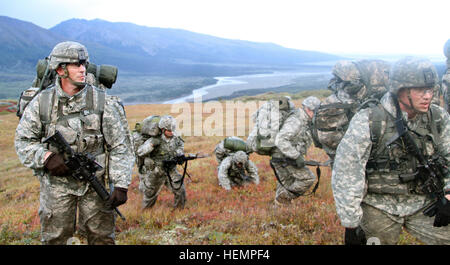 Col. Brian Reed, Commander of the 1st Stryker Brigade Combat Team, 25th Infantry Division, and company commanders from throughout the Brigade take a short break during their trek up the mountain to the high angle range at the Northern Warfare Training Center in Black Rapids, Alaska Sept. 3. (U.S. Army photo by Sgt. Michael Blalack, 1/25 SBCT Public Affairs) Operation Wolfpack 130903-A-AX238-012 Stock Photo