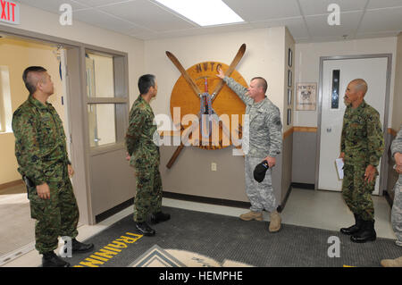 Northern Warfare Training Center Commander Maj. William Prayner explains the unit's history and how it came to be known as the NWTC to Gen. Tetsuro Yamanoue, chief, Training and Education, Japan Ground Self-Defense Force, during a tour of Fort Wainwright's training sites and resources as part of a budding partnership between U.S. Army Alaska and the Japanese, Sept. 6, 2013. (U.S. Army Alaska photo by Staff Sgt. Trish McMurphy, USARAK Public Affairs) Japanese general visits Fort Wainwright, Alaska 130906-A-RT214-008 Stock Photo