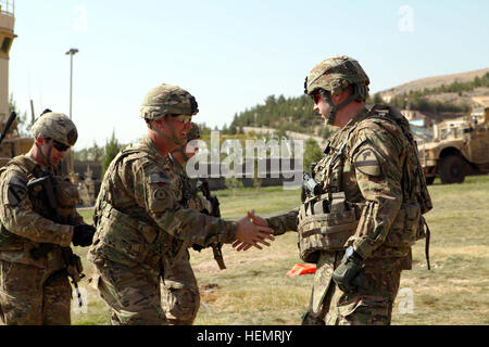 U.S. Army Lt. Col. Mark Huhtanen, right, deputy brigade commander of 2nd Brigade Combat Team, 1st Cavalry Division greets Brig. Gen. James Blackburn, the deputy commander of the U.S. Army 3rd Corps and International Security Assistance Force at the U.S. Consulate Herat, Herat province, Afghanistan, Sept. 24, 2013. Delta Company, 1st Battalion, 5th Cavalry Regiment, 2nd Brigade Combat Team, 1st Cavalry Division conducted a re-enlistment ceremony for five U.S. soldiers at the U.S. consulate. (U.S. Army photo by Spc. Ryan D. Green/Released) Delta Company, 1-5 Cavalry re-enlistment ceremony at US  Stock Photo