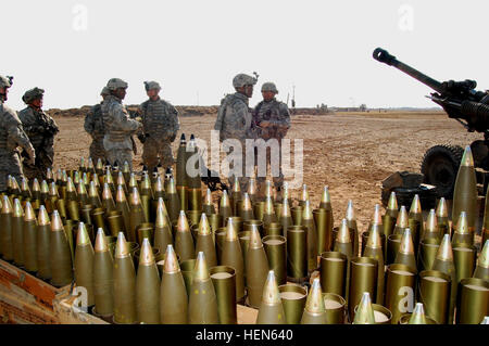 M119 A2 Howitzer Section Soldiers from A Battery, 2-320th Field Artillery, 1st Brigade Combat Team, 101st Airborne Division (Air Assault) standby for their next fire mission during Operation Fulton Harvest, Jan. 12. The operation netted an extremist hideout camp, underground bunkers, vehicle-borne explosives and 30 pressure-plate explosives. Operation Fulton Harvest 73045 Stock Photo