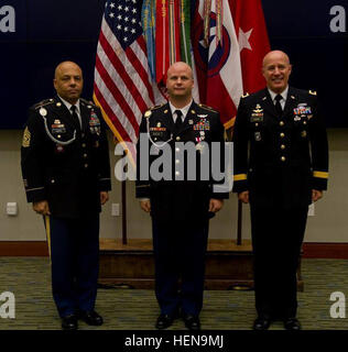 Staff Sgt. Brian Norheim (center), air and missile defense noncommissioned officer in charge, U.S. Army Central, stands with Command Sgt. Maj. John Harris (left), command sergeant major, Headquarters and Headquarters Battalion, USARCENT, and Brig. Gen. David C. Coburn (right), director of resource management, USARCENT, at a Celebration of Service Ceremony Dec. 13 at Patton Hall. (U.S. Army photos by Staff Sgt. Taikeila Chancey, U.S. Army Central Public Affairs.) U.S. Army Staff Sgt. Brian Norheim, center, an air and missile defense noncommissioned officer in charge with U.S. Army Central (USAR Stock Photo