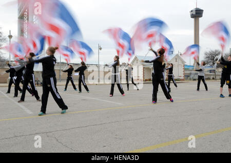 Color guard members for the 2014 U.S. Army All-American Bowl practice flag waiving while being mentored by United States Army Field Band members at the Alamodome in San Antonio Jan. 1, 2014. The color guard is here to perform during the 2014 U.S. Army All-American Bowl, a competition that draws the top high school football players from across the country. This year's game is scheduled for Jan. 4, 2014. (U.S. Army Reserve photo by Pfc. Thomas C. Love, 205th Press Camp Headquarters) Flag waving 140101-A-NN051-315 Stock Photo