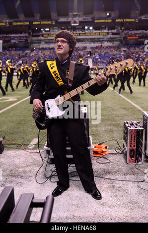 Jay Dineen from Athens Drive High School in Tampa, Fla., pit-electric bass of the 2014 U.S. Army All-American Bowl Marching Band, performs during the half time show at the Alamodome in San Antonio Jan. 4, 2014. The All-American Marching Band features 125 of the top high school marching band members from across the United States. (U.S. Army Reserve photo by Spc. Victor Blanco, 205th Press Camp Headquarters/2014 U.S. Army All-American Bowl JIB) Dineen plays his heart out 140104-A-GX635-277 Stock Photo