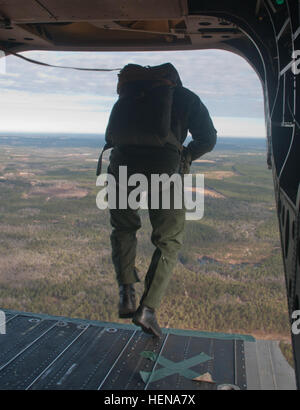 Dutch and American paratroopers joined forces for airborne operations on Sicily Drop Zone, Jan. 9. A total of 220 soldiers from the 1st Brigade Combat Team, 82nd Airborne Division, and the Royal Netherlands Army 11th Airmobile Brigade jumped from the All American Division's CH-47 Chinook helicopters. The American troops earned foreign jump wings, as they were ushered out of the aircraft by a Dutch jumpmaster. In turn, an American jumpmaster guided the Dutch troops off the back ramp. The mission was part of the All American Division's interoperability training with the Dutch forces. (U.S. Army  Stock Photo