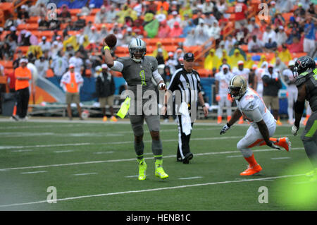 Cameron Newton, a quarterback with the Carolina Panthers, scrambles for a pass during the 2014 Pro Bowl at the Aloha Stadium Jan. 26. Newton played on Team Sanders during the Pro Bowl. Cam Newton, Cameron Jordan 2014 Pro Bowl Stock Photo