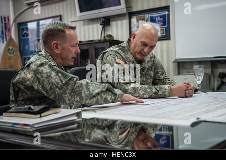 U.S. Army Lt. Gen. Bernard Champoux, left, the commanding general of Eighth Army, briefs Chief of Staff of the U.S. Army Gen. Raymond T. Odierno at the Eighth Army Headquarters in Seoul, South Korea, Feb. 24, 2014. Odierno visited various commands and soldiers during his trip the area.  (U.S. Army photo by Sgt. Mikki L. Sprenkle/Released) U.S. Army Lt. Gen. Bernard Champoux, left, the commanding general of the Eighth Army, briefs Chief of Staff of the Army Gen. Raymond T. Odierno at the Eighth Army headquarters in Seoul, South Korea, Feb. 24 140224-A-KH856-022 Stock Photo