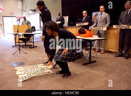 The 81st Regional Support Command held their annual Black History Month celebration at Fort Jackson, S.C., on Feb. 27. Pictured here, skit cast members lay the planks of the 'bridge' to civil rights, freedom and equality. Black History Month at 81st Regional Support Command 140227-A-IL912-046 Stock Photo