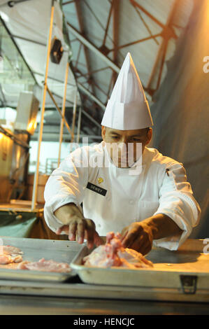 A soldier from the 103rd Expeditionary Sustainment Command operates the ...