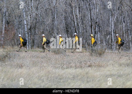 Fire departments and other emergency agencies help the military aviation crews from 2nd General Support Aviation Battalion, 4th Aviation Regiment, 4th Combat Aviation Brigade, 4th Infantry Division, and the Colorado Army National Guard pinpoint areas to improve their water drop accuracy during the 2014 Buckley Firefighting Conference wildfire training at Chadwick Lake in Denver, March 25. (Photo by Sgt. Jonathan C. Thibault, 4th Combat Aviation Brigade Public Affairs Office, 4th Infantry Division/Released) 4th CAB attends Buckley Firefighting Conference 140325-A-RI441-981 Stock Photo