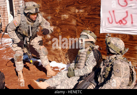 A medic from Company D, 1st Combined Arms Battalion, 67th Armored Regiment moves in to treat injured Soldiers during the Gauntlet II exercise. Soldiers Hone Their Skills in Gauntlet II Exercise 79591 Stock Photo