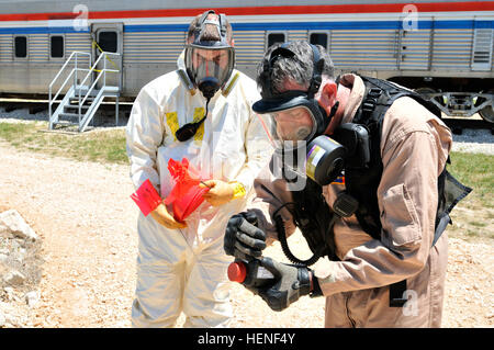 In this image, members of the 6th Civil Support Team support the 2014 Blue Operational Readiness Exercise, hosted by Texas Task Force 1, at Disaster City near College Station, Texas. The exercise, which also featured the College Station Fire Department, tested the response capabilities and interagency cooperation of the three organizations during a simulated pipeline explosion April 25, 2014. Photo by Sgt. 1st Class Daniel Griego. Guardsmen train alongside civil partners to save lives 140425-A-OH613-024 Stock Photo