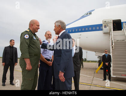 U.S. Secretary of Defense Chuck Hagel (right) greets Romanian Air Force Col. Adrian Vasile, the commander of MK Air Base, during a tour of installation facilities conducted June 4. The secretary met with key Romanian and U.S. leaders and American service members during the visit. The MK visit is part of a wide-ranging 12-day trip including stopovers in Europe, Southwest Asia and the Far East. According to DoD officials, Hagel met with international defense leaders and thanked U.S. military personnel for their service during the tour. Hagel's last scheduled stop is in Normandy, France, where th Stock Photo