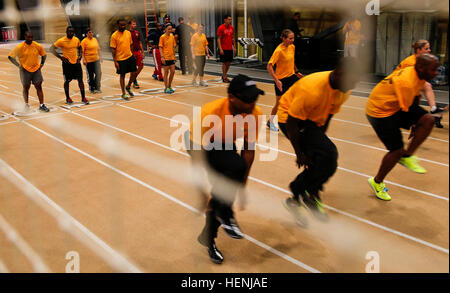 U.S. Soldiers warm-up to train during practice sessions of the 2014 U.S. Army Warrior Trials at the U.S. Military Academy, West Point, N.Y., June 9, 2014. The Army Warrior Trials represent the resilient spirit of today's wounded, ill, and injured service members from all branches of the military. These athletes demonstrate the power of ability over disability as they compete for a spot on the Army Warrior Games team. (U.S. Army photo by Spc. James K. McCann/Released) 2014 US Army Warrior Trials 140609-A-SW162-003 Stock Photo