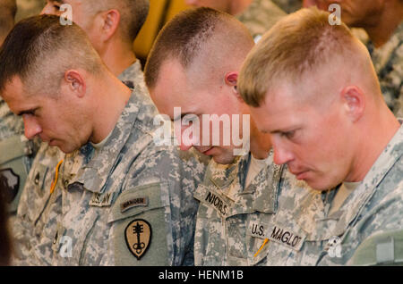 Spc. Zachary Nickels, Staff Sgt. Jeremy Maglott, and Staff Sgt. Landon Nordby await results of the 2014 Army Reserve Best Warrior Competition. 2014 Army Reserve Best Warrior Competition 140627-A-PY026-834 Stock Photo