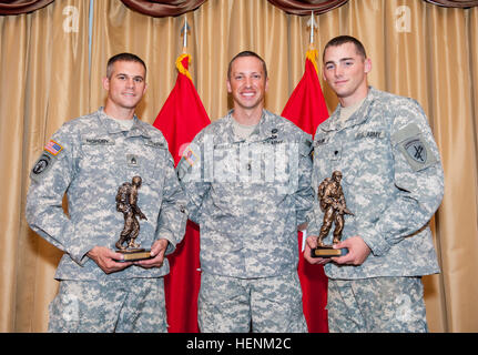 Sgt. 1st Class Jason Manella, the 2013 Noncommissioned Officer of the Year, stands with the winners of the 2014 Army Reserve Best Warrior Competition: Staff Sgt. Landon Nordby, of St. James, Minn., representing the 200th Military Police Command, and Spc. Keegan Carlson, from Colorado Springs, Colo., representing the U.S. Army Civil Affairs Psychological Operations Command (Airborne) at Joint Base McGuire-Dix-Lakehurst, N.J., June 27. The competition had two winning categories: noncommissioned officer and junior enlisted. (U.S. Army photo by Sgt. 1st Class Michel Sauret) 2014 Army Reserve Best  Stock Photo