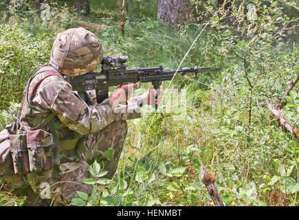 British Army Royal Military Academy Sandhurst cadet Laura Wealsby participates in the individual live-fire movement training. Sandhurst and West Point Military Academy cadets completed their second day of a joint two-week field exercise with live-fire training. The exercise consisted of individual and squad movements on range 204 at the Grafenwoehr Training Area at the U.S. Army's 7th Army Joint Multinational Training Command, July 8. Cadets from Sandhurst are completing their final field exercise and the 50 West Point cadets are completing their leadership development training in an exercise  Stock Photo