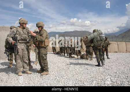 Soldiers from 2nd Battalion, 503rd Infantry Regiment, 173rd Airborne Brigade, the Afghan National Army, and the Afghan Border Patrol conduct training on how to enter and exit a CH-47 Chinook in preparation for operation Rock Tempest that will begin on April 12, at FOB Fortress in the Konar province, Afghanistan on April 11, 2008. (U.S. Army photograph/Sgt. Johnny R. Aragon) Airborne, Afghani army soldiers prepare for joint operation. 86957 Stock Photo