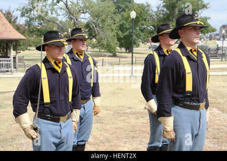 Members of the 1st Cavalry Division Honor Guard prepare to execute a saber presentation during the 1st Air Cavalry Brigade, 1st Cav. Div’s 30th birthday commemoration at the 1st Cav. Div. Museum at Fort Hood, Texas, Sept. 16. Although celebrating its 30th anniversary, the Air Cav traces its history back to Feb. 1, 1963, when the Army began to gather helicopters and first tested an airmobile concept. 1st Air Cav commemorates 30th birthday 140916-A-WD324-008 Stock Photo