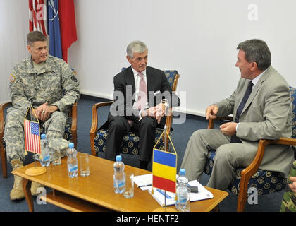 John McHugh (center), the secretary of the Army, and Maj. Gen. John R. O’Connor (left), the commanding general of the 21st Theater Sustainment Command, meet with Valeriu Nicut (right), the Romanian state secretary for defense plans and policy, during a visit to the Mihail Kogalniceanu Air Base in Romania, Sept. 20. McHugh met with both permanent party service members as well as those transiting through MK following a deployment in Afghanistan.  (Photo by Staff Sgt. Warren W. Wright Jr., 21st TSC Public Affairs) SecArmy thanks returning service members during Romania visit 140920-A-HG995-003 Stock Photo
