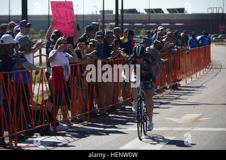 Army Capt. Ashley Ritchey from Colorado Springs, Colo., competes in the women’s open bicycle 20-kilometer race at Fort Carson, Colo. Ritchey is a member of the U.S. Special Operations Command (USSOCOM) adaptive sports team competing in the 2014 Warrior Games in Colorado Springs, Colo., from Sept. 28 to Oct. 4. The Warrior Games, founded in 2010, are designed to support healing and recovery of wounded, ill and injured service members and veterans through adaptive sports. U.S. Special Operations Command team, Warrior Games 2014 140929-A-FT904-125 Stock Photo