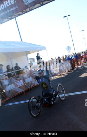 Retired Marine Cpl. Justin Gaertner from Tampa, Fla., finishes first in men’s handcycle 10-kilometer race, Sept. 29, during the 2014 Warrior Games in Colorado Springs, Colo. Athletes from the U.S. Special Operations Command (USSOCOM) Adaptive Sports Program are competing against teams from all the branches from Sept. 28 to Oct. 4. The Warrior Games, founded in 2010, are designed to support healing and recovery of wounded, ill and injured service members and veterans through adaptive sports. US Special Operations Command team, Warrior Games 2014 140929-A-FT904-044 Stock Photo