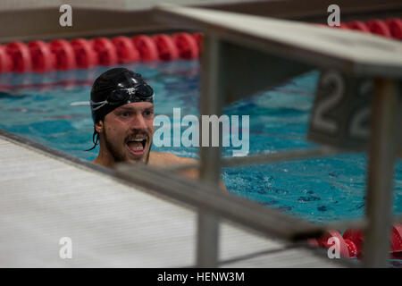 Retired Air Force Staff Sgt. Christopher Tyndall, from Frenchtown, Mont., competes in the men’s 50-meter freestyle race, Sept. 30, during the 2014 Warrior Games in Colorado Springs, Colo. Tyndall is a member of the U.S. Special Operations Command (USSOCOM) Adaptive Sports Program. USSOCOM team members are competing against teams from all the branches, Sept. 28 to Oct. 4. The Warrior Games, founded in 2010, are designed to support healing and recovery of wounded, ill and injured service members and veterans through adaptive sports. US Special Operations Command team, Warrior Games 2014 140930-A Stock Photo