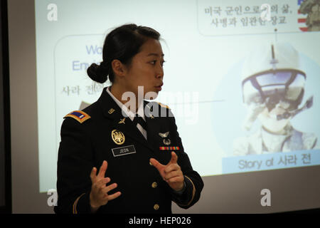 First Lt. Sarah Jeon, a pilot from the 4th Aerial Reconnaissance Battalion (Attack), 2nd Aviation Regiment, 2nd Combat Aviation Brigade, 2nd Infantry Division, visited the Sookmyung Women's University on Nov. 18 in Seoul, South Korea. She talked with female ROTC students about the life in Army aviation and provided them with motivation to strive for what they want to do with their careers. One of the first female Korean American AH-64 Apache helicopter pilots 141118-A-TU438-174 Stock Photo