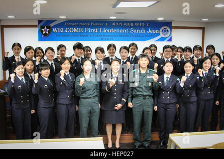 First Lt. Sarah Jeon, a pilot from the 4th Aerial Reconnaissance Battalion (Attack), 2nd Aviation Regiment, 2nd Combat Aviation Brigade, 2nd Infantry Division, visited the Sookmyung Women's University on Nov. 18 in Seoul, South Korea. She talked with female ROTC students about the life in Army aviation and provided them with motivation to strive for what they want to do with their careers. One of the first female Korean American AH-64 Apache helicopter pilots 141118-A-TU438-286 Stock Photo