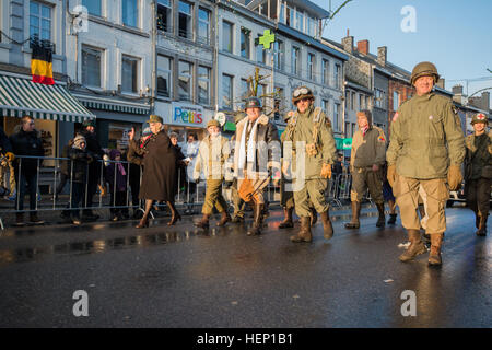 Re-enactors roleplaying famous historical figures, including Gen. George S. Patton, close the victory parade commemorating Battle of the Bulge's 70th anniversary in Bastogne, Belgium, Dec. 14, 2014. Gen. Patton's Third Army freed the U.S. 101st Airborne Division trapped in Bastogne. (U.S. Army photo by Visual Information Specialist Pierre-Etienne Courtejoie/Released) Battle of the Bulge's 70th anniversary commemorations victory parade 141214-A-BD610-355 Stock Photo