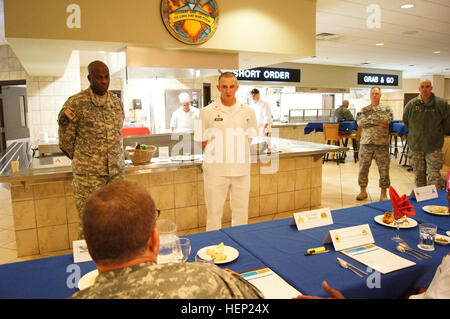 Sgt. Kory Bender, Alpha Company, 40th Expeditionary Signal Battalion, 11th Signal Brigade, listens to the judges as they critique his dishes during the competition. Bender left Fort Huachuca to compete in the Culinary Arts Noncommissioned Officer of the Quarter board at Fort Hood, Texas, Jan. 7. After winning the board, he went on to the Culinary Arts NCO of the Year competition Jan. 8–9. (U.S. Army photo by Staff Sgt. Kelvin Ringold) Sergeant cooks up a win at Culinary Arts of Quarter board 150109-A-HT688-473 Stock Photo