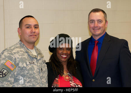 Dr. Karen Johnson, associate professor of education at the University of Utah, poses for a group photo with equal opportunity advisers Sgt. 1st Class William Yazzie and Greg Rogers during a Black History Month observance held at Fort Douglas, Utah, Feb. 25. The purpose of the event was to spread cultural awareness and provide a history lesson on the role of the African-American female during the Civil War. (U.S. Army photo by Capt. Chad M. Nixon) Ethics professor supports Fort Douglas with Black History observance 150225-A-ZZ999-001 Stock Photo