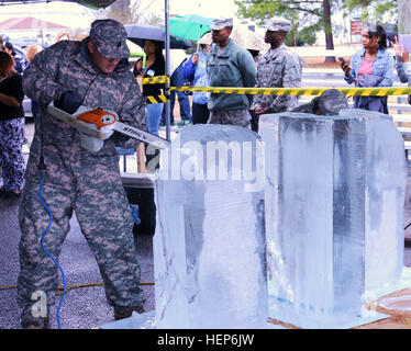 A soldier from the 103rd Expeditionary Sustainment Command operates the ...