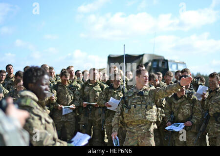 British officer cadets from the Royal Military Academy Sandhurst joined U.S. Army paratroopers from 1st Battalion, 503rd Infantry Regiment, 173rd Airborne Brigade during various combined arms demonstrations and live-fire events, here March 12, 2015. (U.S. Army photo by Spc. Brett Hurd) British Army cadets join US 173rd Airborne Brigade in Germany 150311-A-SC984-001 Stock Photo