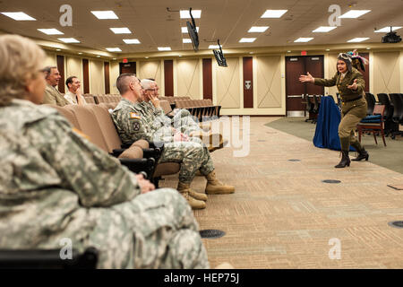 Kate Campbell Stevenson performs as Bessie Coleman during her one-woman show, 'Women: Back to the Future' at the U.S. Army Forces Command and U.S. Army Reserve Command headquarters at Fort Bragg, N.C., March 17, 2015. Portraying Coleman, Louis Arner Boyd and Eleanor Roosevelt, Stevenson dressed in period clothing and shared the women's stories in song and monologues to show how they overcame gender-based and societal obstacles to achieve personal and historical success. “Women’s stories have been there all along, we just have to be willing to dig to find them,” said Stevenson. “I present these Stock Photo