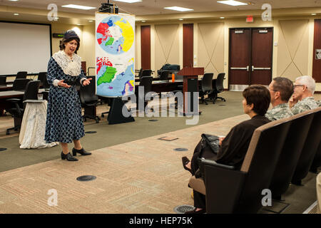 Kate Campbell Stevenson performs as Eleanor Roosevelt during her one-woman show, 'Women: Back to the Future' at the U.S. Army Forces Command and U.S. Army Reserve Command headquarters at Fort Bragg, N.C., March 17, 2015. Portraying Bessie Coleman, Louis Arner Boyd and Roosevelt, Stevenson dressed in period clothing and shared the women's stories in song and monologues to show how they overcame gender-based and societal obstacles to achieve personal and historical success. “Women’s stories have been there all along, we just have to be willing to dig to find them,” said Stevenson. “I present the Stock Photo