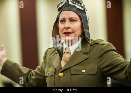 Kate Campbell Stevenson performs as Bessie Coleman during her one-woman show, 'Women: Back to the Future' at the U.S. Army Forces Command and U.S. Army Reserve Command headquarters at Fort Bragg, N.C., March 17, 2015. Portraying Coleman, Louis Arner Boyd and Eleanor Roosevelt, Stevenson dressed in period clothing and shared the women's stories in song and monologues to show how they overcame gender-based and societal obstacles to achieve personal and historical success. “Women’s stories have been there all along, we just have to be willing to dig to find them,” said Stevenson. “I present these Stock Photo