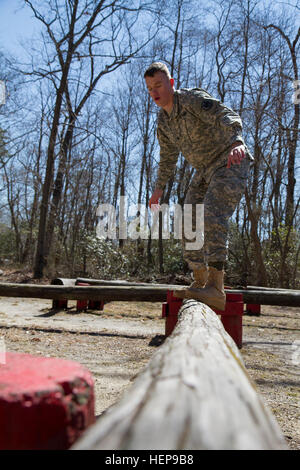 Army Reserve Spc. Michael Goff, 23, a Military Police Soldier, completes an obstacle course event during day two of the 200th Military Police Command’s Best Warrior Competition on April 1 at Joint Base McGuire-Dix=Lakehurst, N.j. Eight warfighters are competing in the week-long competition held March 31-April 3 in a variety of physical and mental events to earn the top spot of Best Warrior for Soldier and noncommissioned officer of the year. Goff is assigned to the 366th MP Company and from Dallas, Texas. The winners will compete at the Army Reserve Best Warrior Competition held in May. The 20 Stock Photo