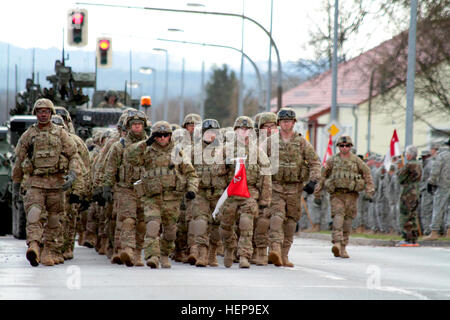 Soldiers from the 2nd Cavalry Regiment march into Rose Barracks, their home base, as they complete their 1,800 km 'Dragoon Ride' from Estonia, Lithuania and Poland on April 1, 2015. The 16th Sustainment brigade provided all three 'Dragoon Ride' convoys with logistical support. The Knight's Brigade Soldiers later earned their 'silver spurs' from the 2nd Cavalry Regiment for their participation. (U.S. Army photo by 1st Lt. Henry Chan, 16th Sustainment Brigade Public Affairs, 21st Theater Sustainment Command) Dragoon Ride complete 150401-A-WZ553-825 Stock Photo