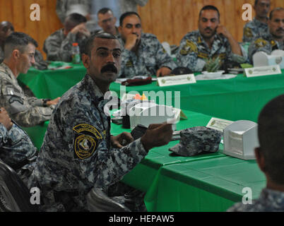 5-2 NP. FORWARD OPERATING BASE FALCON, Iraq – Iraqi Command Sgt. Maj. Ameer Abbas Kadhum Khames, assigned to the 5th Brigade, 2nd National Police Division, takes part in discussions regarding the history of the Iraqi noncommissioned officer corps July 27 at Forward Operating Base Falcon, Baghdad. Command Sgt. Maj. Michael Bobb, the top enlisted Soldier for the 1st Brigade Combat Team, 4th Infantry Division, Multi-National Division – Baghdad, invited the Rashid district’s senior enlisted Iraqi soldiers and policemen to take part in the first combined forces professional development conference h Stock Photo